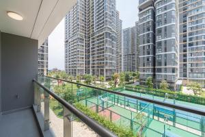 a balcony with a view of tall buildings at Lucent Home in Gò Công
