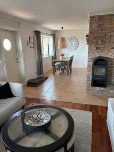 a living room with a couch and a fireplace at Casa utsikten in Uddevalla +2 photos