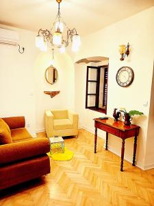 a living room with a couch and a table at Cozy Central Nest Kotor in Kotor