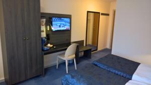 Ένα ή περισσότερα κρεβάτια σε δωμάτιο στο Hotel Falster