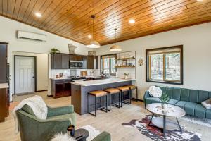 a kitchen and living room with a couch and a table at Long Lake Cabin w/ Dock: Fish & Hike! in Walker