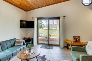 a living room with a couch and a table at Long Lake Cabin w/ Dock: Fish & Hike! in Walker