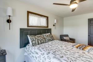 a bedroom with a bed and a ceiling fan at Long Lake Cabin w/ Dock: Fish & Hike! in Walker