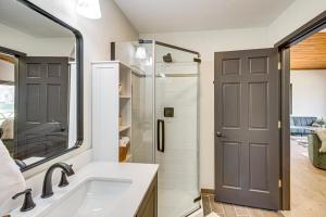 a bathroom with a sink and a shower at Long Lake Cabin w/ Dock: Fish & Hike! in Walker +18 photos
