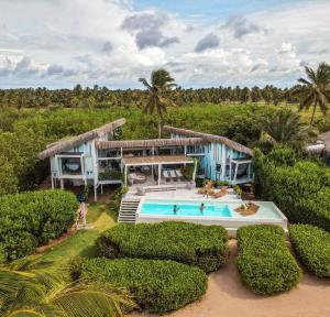 an aerial view of a resort with a swimming pool at Beach Houses Moitas in Amontada +53 photos