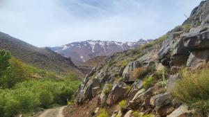 a dirt road on a mountain with mountains in the background at Gite d'étape La terre Amazigh in Amaskar +27 photos