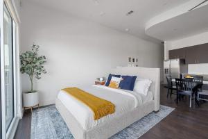 a bedroom with a bed and a dining room at Million Dollar Fireworks View no 412 in Dallas