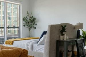 a bedroom with a bed and a table and a window at Million Dollar Fireworks View no 412 in Dallas +12 photos