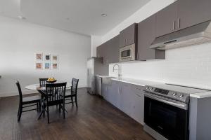 a kitchen with a table and chairs and a stove at Million Dollar Fireworks View no 412 in Dallas
