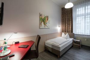 Postel nebo postele na pokoji v ubytování Hotel Stadtkrug