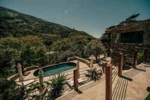 a swimming pool on a deck next to a building at Ellafos Traditional Living-Elafonisi Couples Retreat in Elafonisi
