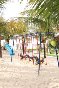 a group of swings on a beach at Pousada Villa Ricca Park in Niquelândia