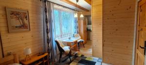 a room with a table and a window at Apartamenty u drwala in Zakopane +71 photos