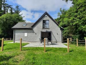 a house with its door open in a yard at Corradiller Quay, Lisnaskea, Fermanagh in Lisnaskea