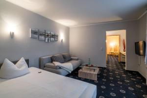 Postel nebo postele na pokoji v ubytování Hotel Stadtkrug