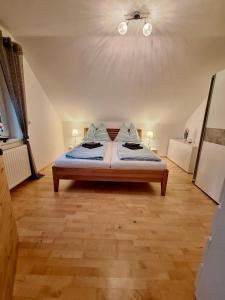 a bedroom with a bed with blue sheets on it at Ferienhaus Wolfi in Eberndorf