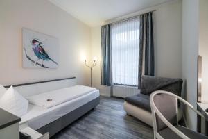Postel nebo postele na pokoji v ubytování Hotel Stadtkrug