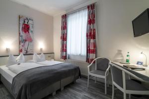 Postel nebo postele na pokoji v ubytování Hotel Stadtkrug