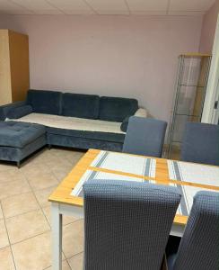 a living room with a couch and a table and chairs at Paide Apartment in Paide