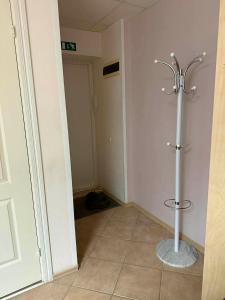 a bathroom with a shower in the corner of a room at Paide Apartment in Paide
