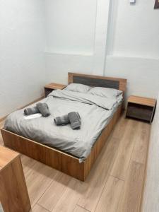 a bed with two pillows on it in a room at Gasparyan's Guest House in Pʼarakʼar