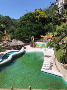 a water slide in a pool at a resort at Eco hotel el molino in San Luis