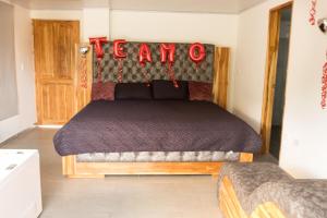 a bedroom with a bed with a sign that reads learn at Eco hotel el molino in San Luis +13 photos