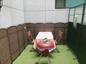 a grill sitting on a table in a room at Daecheon Mud Gongju Pension in Boryeong