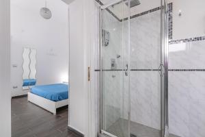 a shower with a glass door in a bathroom at Le Camere Di Anna in Gallipoli