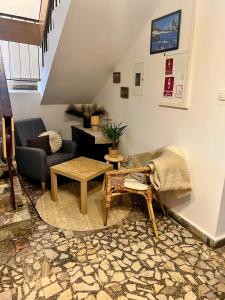a living room with a couch and a table at DW Bukówka in Karpacz