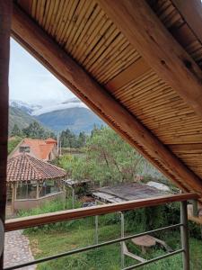 a view from the balcony of a house at Mrs Sapo Chalets in Urubamba