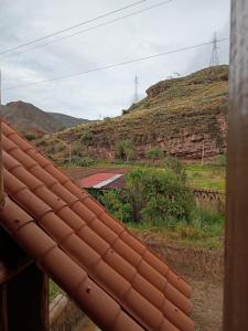 a view of a hill from a roof at Mrs Sapo Chalets in Urubamba