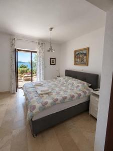 Llit o llits en una habitació de Villa Marijam