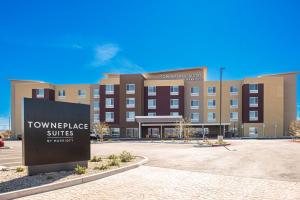 a large building with a sign in front of it at TownePlace Suites by Marriott Ridgecrest in Ridgecrest