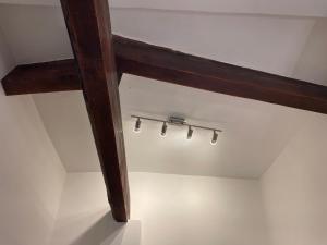 a wooden ceiling with lights in a room at Luxurious Provencal cottage with private Pool, Terrace & Garden in Vence +23 photos