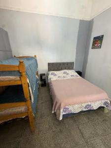 a bedroom with two beds in a room at challet1 in Yerba Buena
