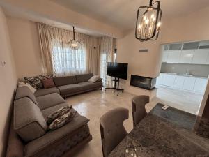 a living room with a couch and a table at Villa in Čeluga +48 photos