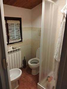 a small bathroom with a toilet and a sink at VILLA CLAUDI b&b in Camerino +25 photos