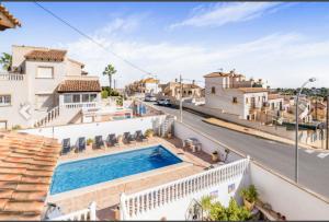 a view from the balcony of a house with a swimming pool at Casa Lanjaron in San Miguel de Salinas