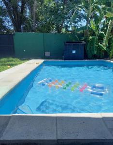 a swimming pool with toys in the water at challet1 in Yerba Buena +1 photo