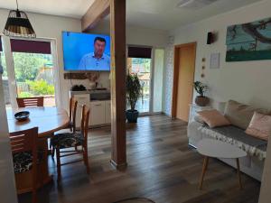 a living room with a couch and a table at Apartments Čebelica in Bohinj