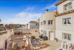 a view of a house with a balcony at Casa Lanjaron in San Miguel de Salinas