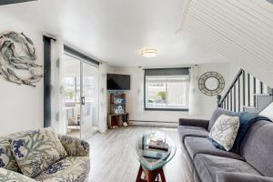 a living room with a couch and a glass table at Wishing Wells in Wells