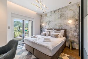 a bedroom with a large bed and a window at Countryside family villa with pool Zmina in Donji Muć +69 photos