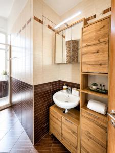 a bathroom with a sink and a glass shower at TOP RATED - PREMIUM Seaview 2-BDR-Apt in tallest building in Larnaca - 2 min Walk to Beach in Larnaca +23 photos