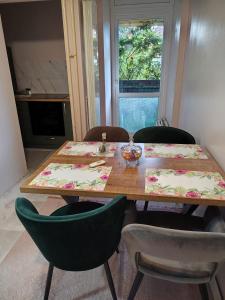 a dining room table with chairs and a table and a table and a table at PANDORA BULEVAR Cacak in Čačak
