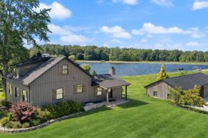 an image of a house with a lake in the background at Standing Rock Farms in Madison
