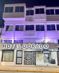 a hotel dorado is lit up at night at Hotel DORADO in Tapachula