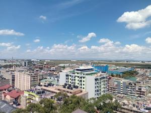 an aerial view of a city with buildings at Victor Airport suites in Nairobi