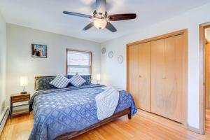 a bedroom with a bed and a ceiling fan at King Bed • 2BR • Sleeps 13 • Historic Location in Elmwood Park
